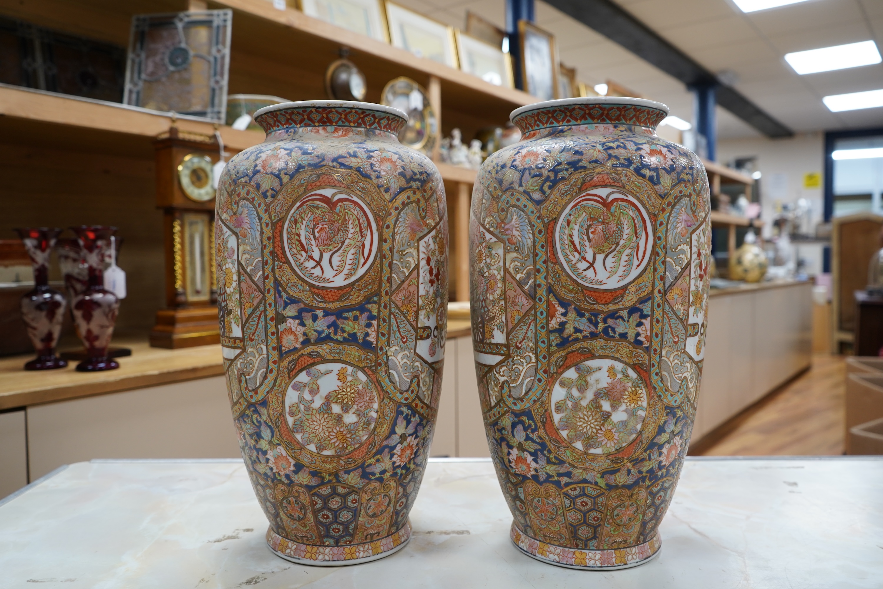 A pair of early 20th century Japanese satsuma pottery vases, 37cm high
